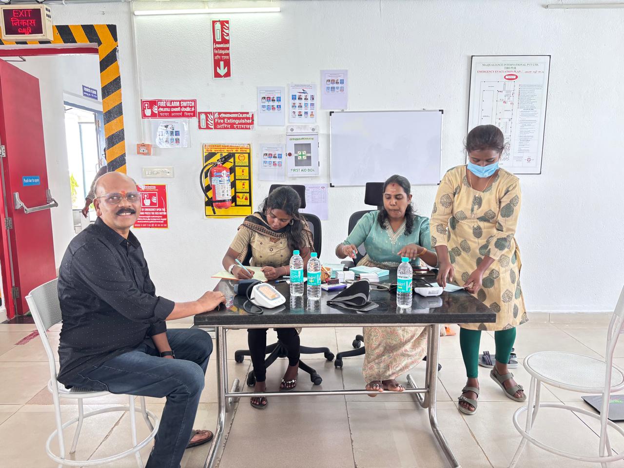 On-site medical camp — blood pressure check and health screening